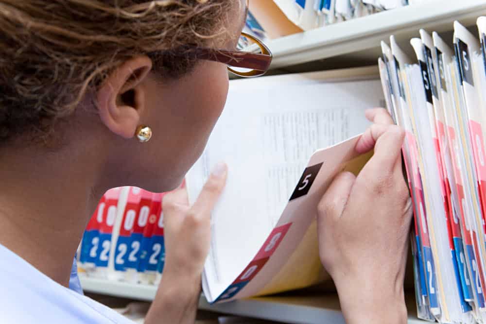 Admin lady looking at a medical record